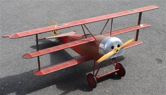 A model of a Fokker Dr1 fighter aircraft in the Red Barons livery length 150cm width 186cm